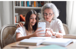 granddaughter and grandma discussing phone